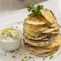 Ethos Chips · Paper-thin zucchini and eggplant chips with tzatziki sauce.