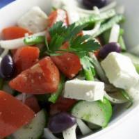 Tomato · Classic Greek salad, cut to order, with tomatoes, cucumbers, peppers, onions, olives, feta a...