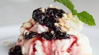 Yogurt · Greek yogurt with attiki honey, black cherry preserve and walnuts.