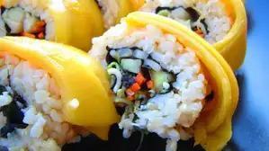 Mango Roll · Fried crab meat apple inside with avocado and mango on top.