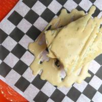 The Nacho Libre Quesadilla Burger · Stuffed and topped with monterey and colby jack cheese, wrapped in a flour tortilla, mexi-ra...