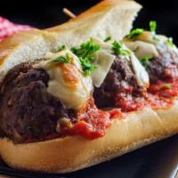 Meatball Hero Sandwich · Delicious juicy meatballs topped with our house sauce and toppings inside a soft delicious h...