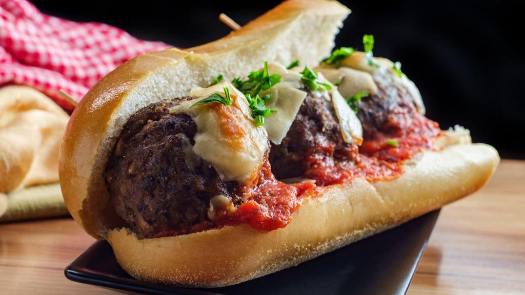 Meatball Hero Sandwich · Delicious juicy meatballs topped with our house sauce and toppings inside a soft delicious hero.