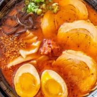 Ajika Ramen · Spicy. Two pieces of charsiu, egg bamboo, spicy sauce, burn garlic sauce, scallions