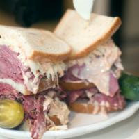 Corned Beef And Pastrami Combo Sandwich · Sandwich with corned beef, pastrami, Swiss cheese, coleslaw, and Russian dressing.
