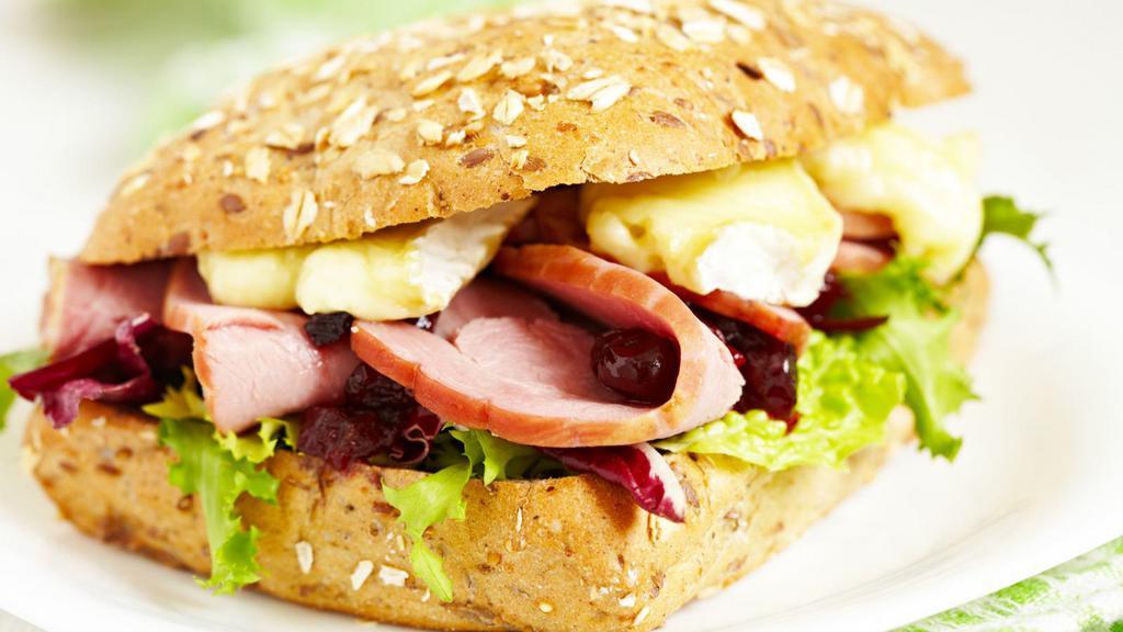 Smoked Turkey Breast Sandwich · Sandwich with smoked turkey breast, American cheese, lettuce, tomato, avocado, and mayo.