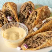 Cheeseburger Eggrolls · Housemade with ground beef, bacon, cheddar cheese and onions.