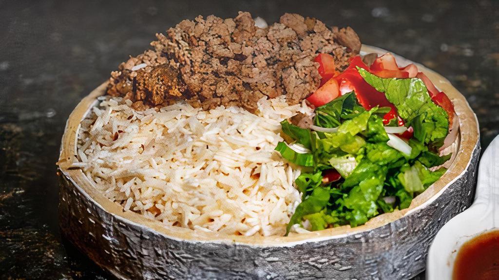 Gyro Over Rice Platter · Served with lamb gyro, rice, lettuce, and tomatoes along with your toppings and white and hot sauce