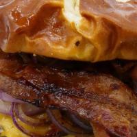 Honey Hennessy Pretzel Burger · Super Action burger, honey Hennessey sauce, double bacon, American cheese and grilled onions.