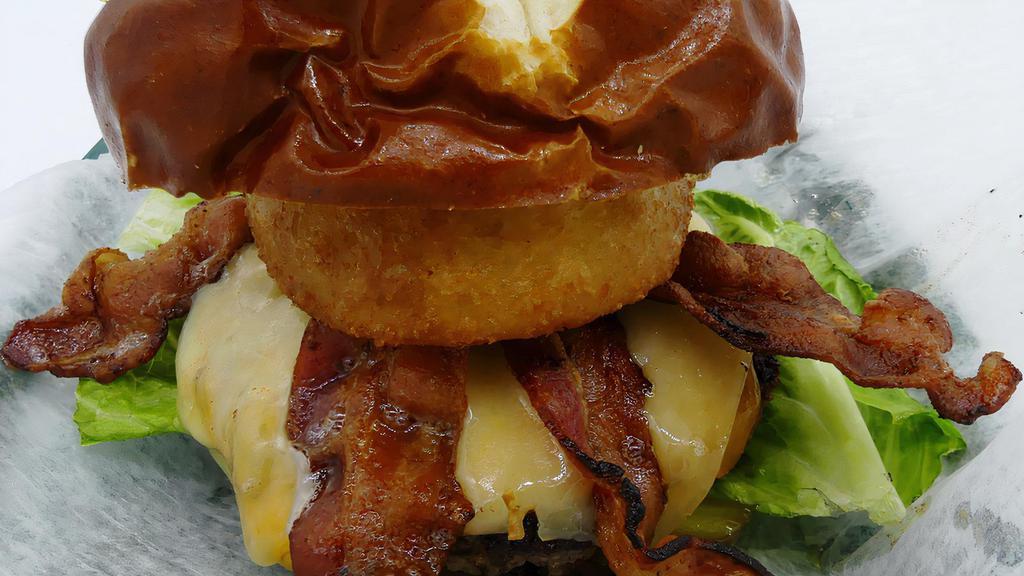 Pretzel Burger Frenzy · Pretzel bun, Action burger, double bacon, cheddar & pepper jack, tomato, pickles, lettuce, onion ring and spicy mayo.