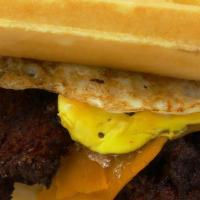 Chicken & Waffle Sandwich · Two Belgian waffles, syrup, two crispy chicken, egg, double bacon, cheddar cheese, grilled o...