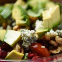 Arugula Salad · Baby arugula, grape tomatoes, avocado, cranberries and walnuts topped with blue cheese and t...