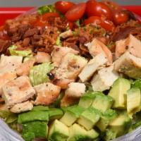 Cobb Salad · Mixture of crisp lettuce, grilled chicken, avocado, bacon and grape tomatoes tossed with blu...