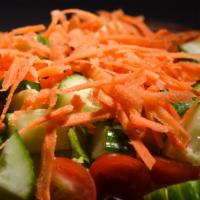 Green Salad · Mixture of crisp lettuce, grape tomatoes, carrots and cucumbers tossed with homemade balsami...