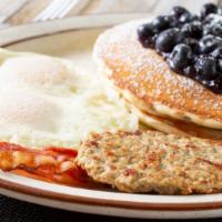 Blueberry Pancakes Platter · 2 fluffy blueberry buttermilk pancakes with choice of meat, eggs and cheese!.