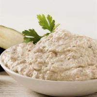 Baba Ghanoush · Eggplant blended with fresh garlic, lemon juice, tahini, and spices.
 Served with Pita bread.