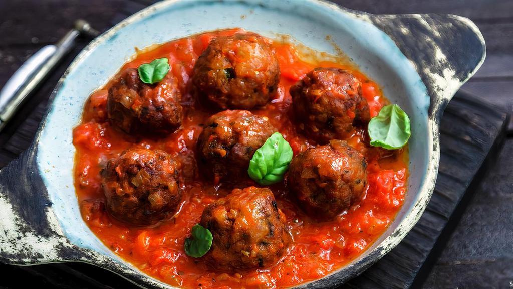 Meatballs · Middle eastern meatballs, made with onions, spices and marinated in tomato sauce.