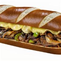 Unreal Cheesesteak · Unreal steak slices, (V) VoiLife Provolone, sautéed onions, sautéed green peppers, and sauté...