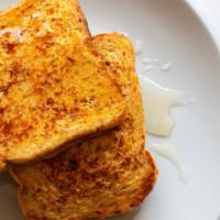French Toast · Warm french toast hot off the griddle, dusted with powdered sugar and served with a side of ...