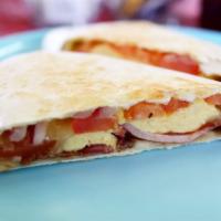 Sleeping Lion Wrap · Breakfast wrap made with Bacon, tomato, egg white, fresh mozzarella and spinach.