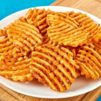 Waffle Fries · Fresh batch of waffle fries.