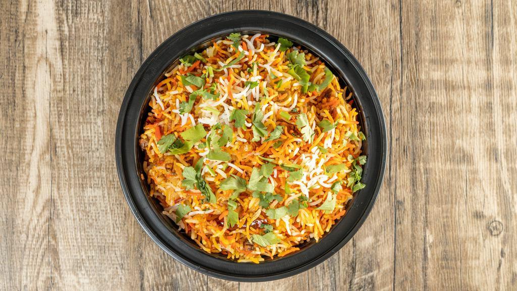 Vegetarian Biryani · Basmati rice with vegetables cooked in herbs & Indian spices.
