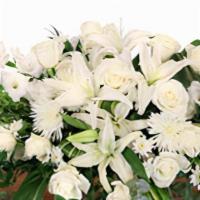 Hushed Goodbye Casket Spray · Send your loved one off with an elegant casket spray that truly encompasses the warmth they ...
