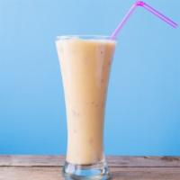 Passion Peach Smoothie · Delicious smoothie made with fresh peaches, bananas, oranges, and apple juice.