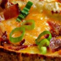 Potato Skins · Served with cheddar cheese, bacon and sour cream.