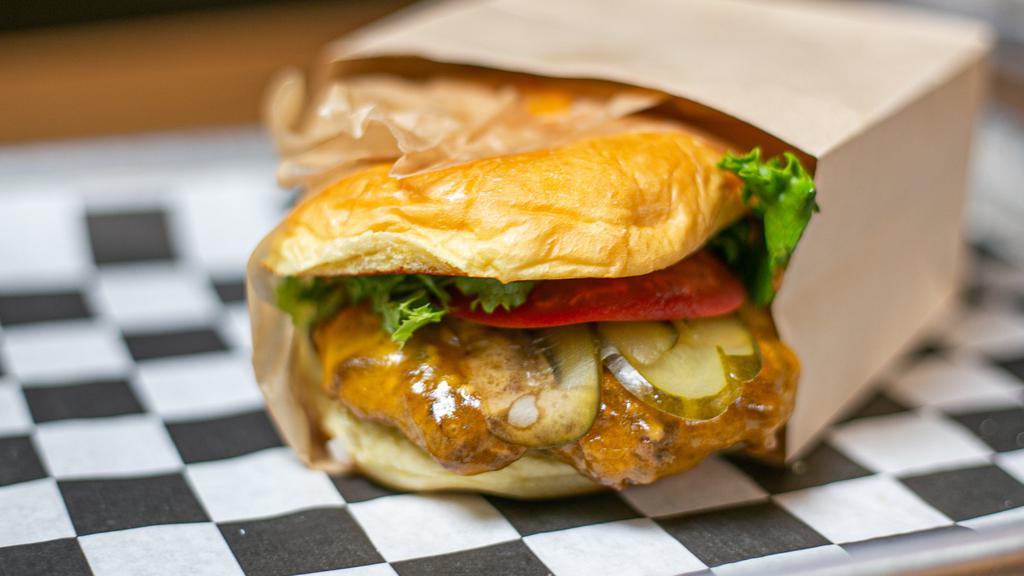Cheese Burger · Come with five oz grass-fed beef pattie, lettuce, tomato, onion, pickles, and mighties sauce.