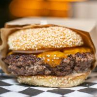 Mighties Burger · Two 5 oz beef patties with cheese and chopped onions.