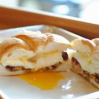 Sausage, Egg & Cheese · house made sausage patty, two over medium eggs and american cheese on a kaiser roll