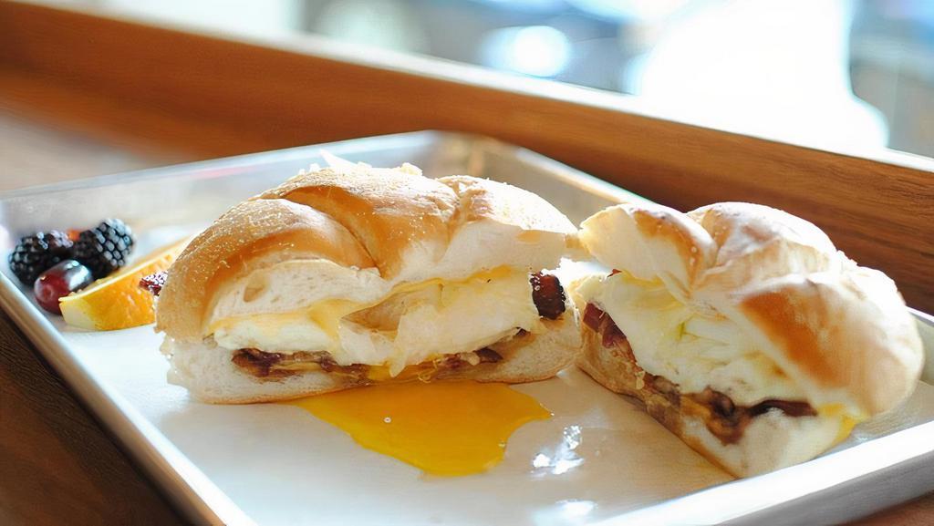 Sausage, Egg & Cheese · house made sausage patty, two over medium eggs and american cheese on a kaiser roll