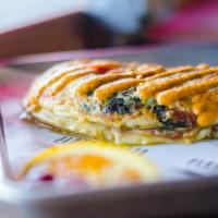 Egg White Omelette · fresh turkey, tomatoes, spinach, gruyere, caramelized onions, egg whites, house made hot che...