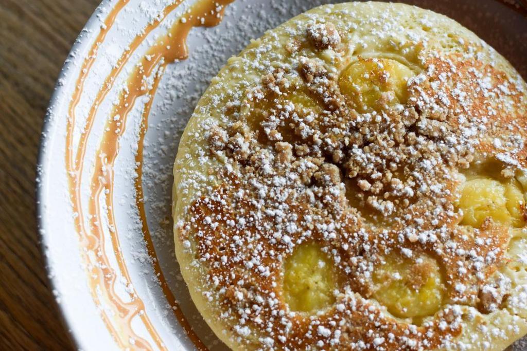 Banana Crumb Pancakes · powdered sugar, dulce de leche, pure maple syrup