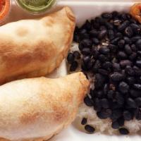 2 Empanadas Of Your Choice, One Side Plus Soda Or Water · 