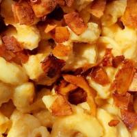 Vegan Mac & Cheese · Macarroni pasta with our
own dairy free cheesy sauce.
ADD Coconut Bacon!