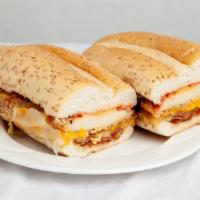 Brano Bomber Sandwich · Chicken cutlets with melted Cheddar, mozzarella cheese, and bacon on  garlic bread. Topped w...