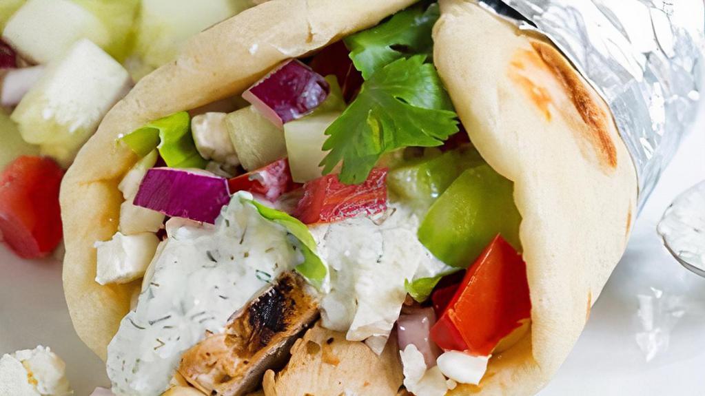 Chicken Gyro · Served on pita w/homemade white sauce lettuce, tomato, and onion.