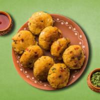 Divine Potato Croquette · Delicious snack made with boiled potatoes mixed with  aromatic spices and herbs and fried ti...