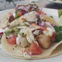 Shrimp Tacos · Sauteed shrimp, garlic, cilantro, jalapeno, lime, sour cream and avocado.