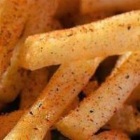 Cajun Fries · Papas fritas con polvo Cajun.