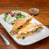 Grilled Vegetable Panini · Fresh mozzarella, roasted red peppers, olive oil and basil. Served with a garden salad and b...