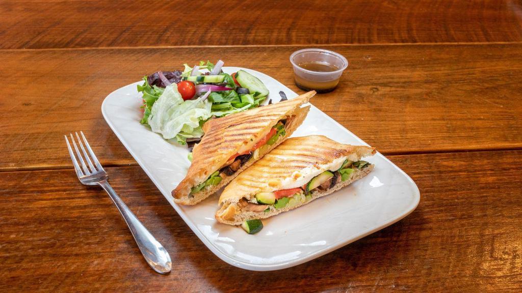 Grilled Vegetable Panini · Fresh mozzarella, roasted red peppers, olive oil and basil. Served with a garden salad and balsamic vinaigrette on the side.
