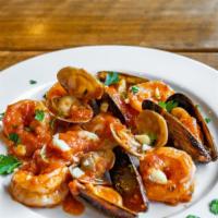 Zuppa Di Pesce · Mussels, clams, shrimps, & salmon in a red sauce.