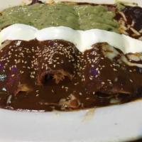 Enchiladas Bandera · Mole sauce topped w/ avocado sauce. Choice of pork, chicken or cheese.