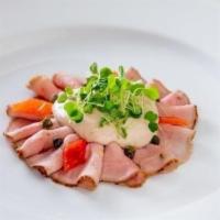Vitello Tonne* · traditional slow-roasted thinly sliced veal tenderloin, yellowfin tuna sauce, pickled capers...
