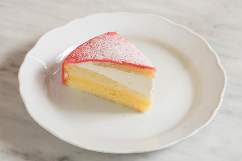 Principessa · a dome of thin almond marzipan, layered with lemon sponge, vanilla pastry cream and whipped cream