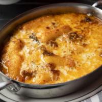 Crispy Rice Cake Lasagna · crispy rice cake lasagna / sweet italian sausage / spicy cabbage / scallions / provolone
