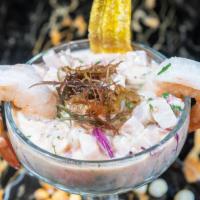 Leche De Tigre · Combination of seafood blended with lime juice.